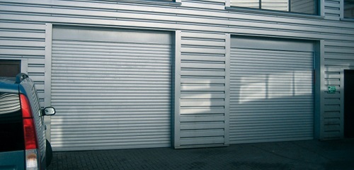 Insulated roller shutter garage doors fitted to modern property